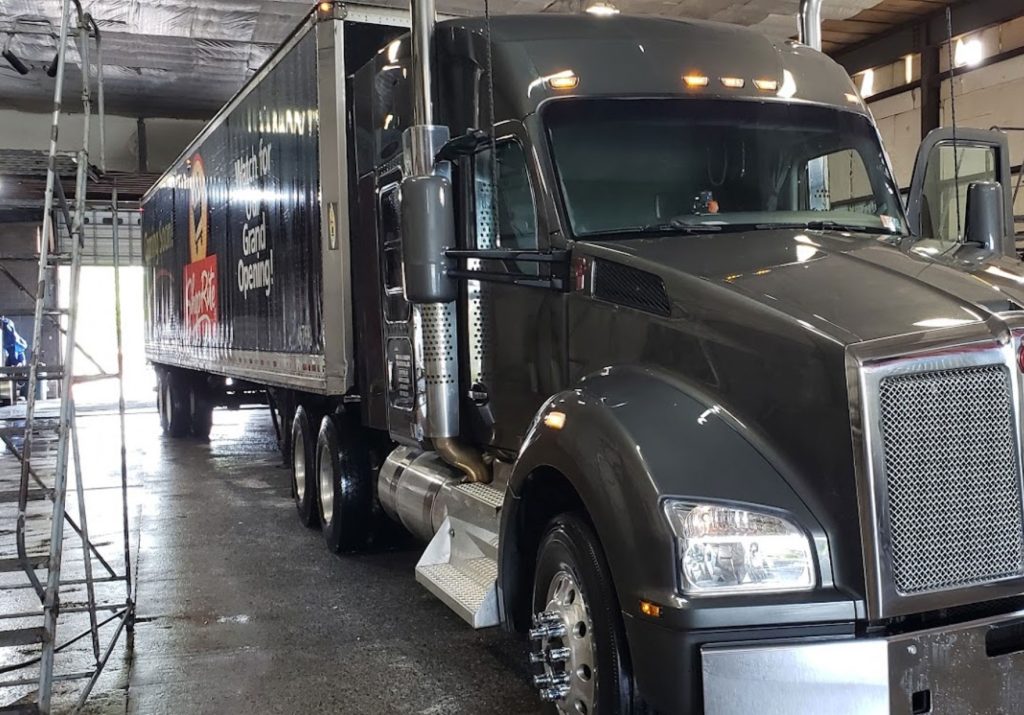 gray truck with shoprite trailer